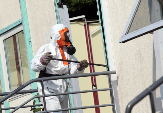 Asbestos Removal man in protective suit